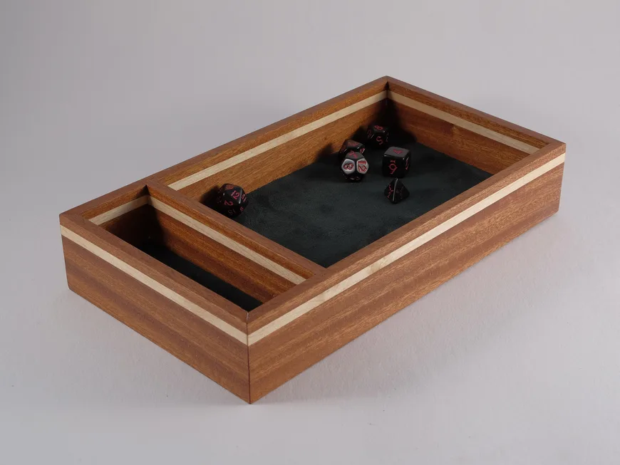 A canarywood dice tray with maple accents and faux suede